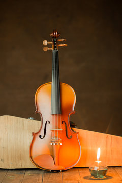 violin with lantern on old steel background,still life