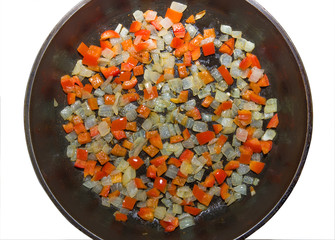 Fried onion and sweet red pepper in the frying pan