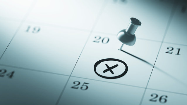 Concept image of a Calendar with a push pin. Closeup shot of a t