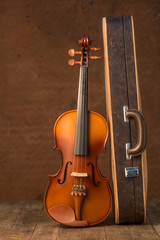 Obraz na płótnie Canvas Vintage violin and case with old steel background