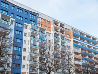 Fototapeta premium Colorful Apartment Building with Bare Trees