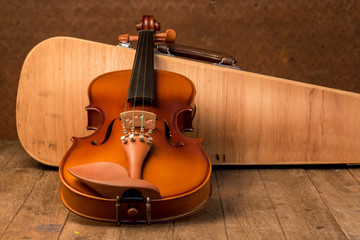 Vintage violin and case with old steel background © ittipol
