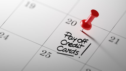 Concept image of a Calendar with a red push pin. Closeup shot of