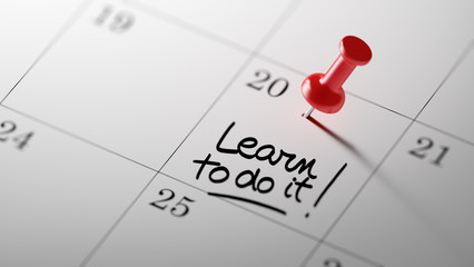 Concept image of a Calendar with a red push pin. Closeup shot of