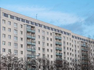 Fototapeta premium Modern Apartment Building with Bare Trees