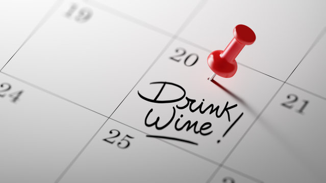 Concept image of a Calendar with a red push pin. Closeup shot of