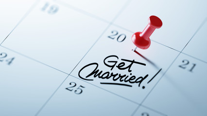 Concept image of a Calendar with a red push pin. Closeup shot of