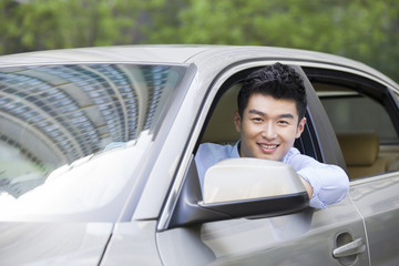 Young man driving car