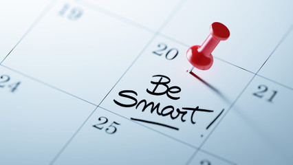 Concept image of a Calendar with a red push pin. Closeup shot of