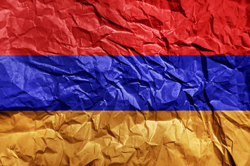 Armenia flag painted on crumpled paper background