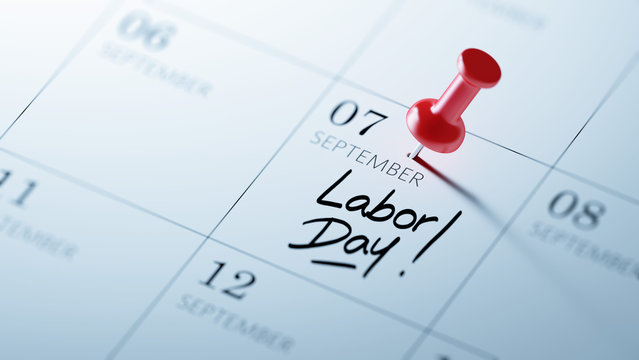 Concept image of a Calendar with a red push pin. Closeup shot of