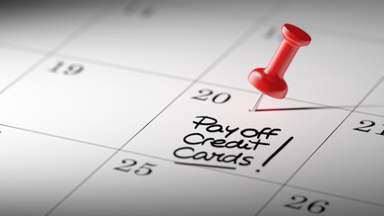 Concept image of a Calendar with a red push pin. Closeup shot of