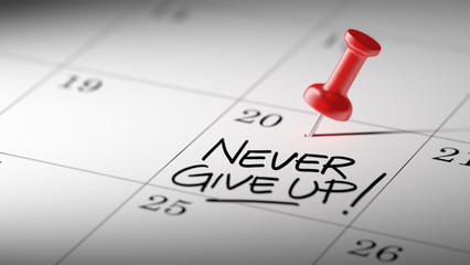 Concept image of a Calendar with a red push pin. Closeup shot of