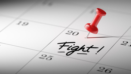 Concept image of a Calendar with a red push pin. Closeup shot of