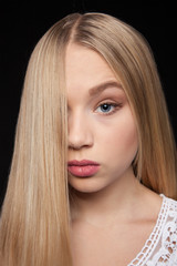 Naklejka premium Portrait of a Beautiful Woman Model black background studio - Stock Image