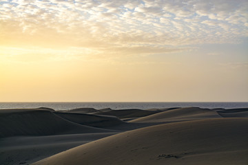 Fototapeta na wymiar sunrise Atlantic ocean, Canary Islands, Dunes Maspalomas, sand, sandy dunes