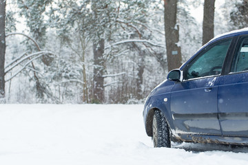 Obraz na płótnie Canvas Car part on a winter road.