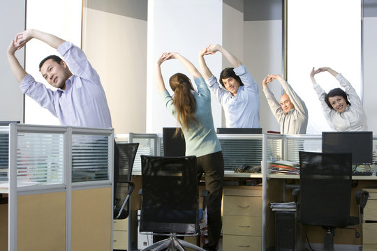 Office workers stretch before they get back to work