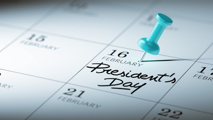 Concept image of a Calendar with a blue push pin. Closeup shot o