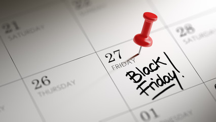 Concept image of a Calendar with a red push pin. Closeup shot of