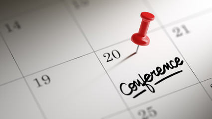 Concept image of a Calendar with a red push pin. Closeup shot of