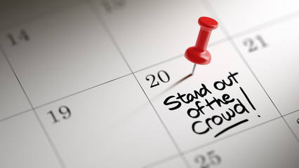 Concept image of a Calendar with a red push pin. Closeup shot of