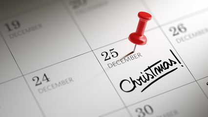 Concept image of a Calendar with a red push pin. Closeup shot of