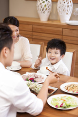 Happy family enjoying meal time