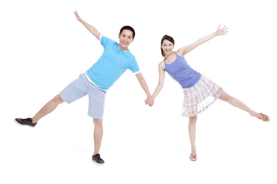 Excited young couple spread-eagled