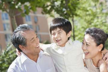 Fototapeta premium Amused grandparents and grandson