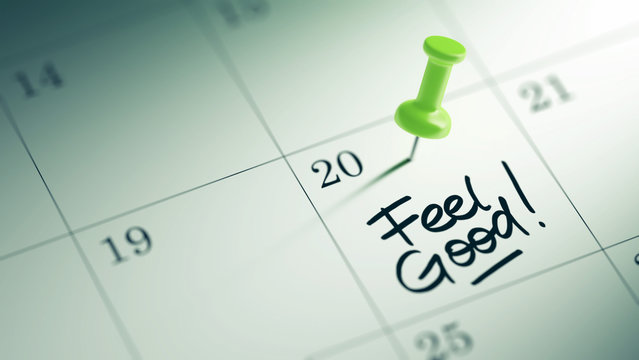 Concept image of a Calendar with a green push pin. Closeup shot