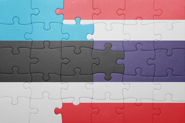 Fototapeta premium puzzle with the national flag of estonia and thailand