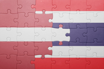 Fototapeta premium puzzle with the national flag of latvia and thailand