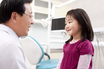 Fototapeta premium Dentist and little patient in dental clinic