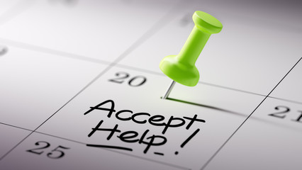 Concept image of a Calendar with a green push pin. Closeup shot