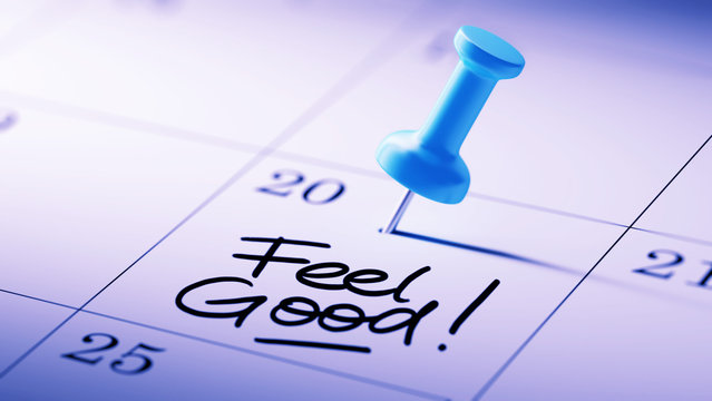 Concept image of a Calendar with a blue push pin. Closeup shot o