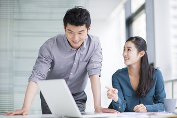 Young business person talking in office