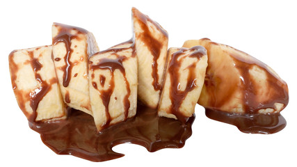 Sliced banana slices drenched with chocolate sauce