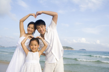 Portrait of young family at the beach