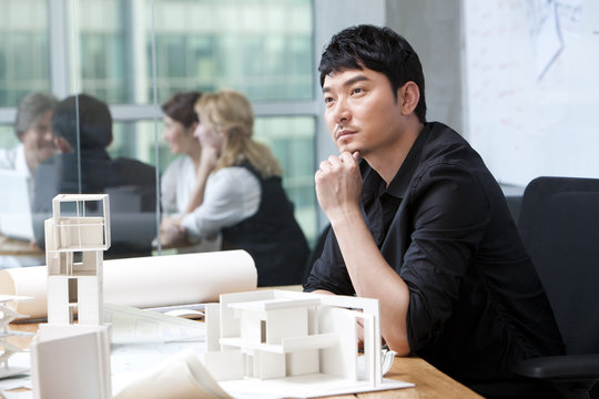  Architect thinking before architectural models