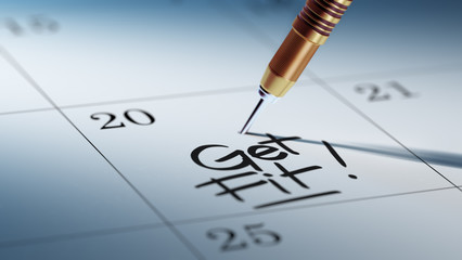 Concept image of a Calendar with a golden dart stick.. The words