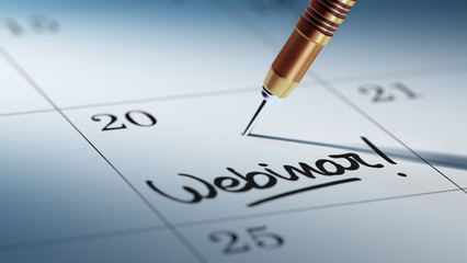 Concept image of a Calendar with a golden dart stick.. The words