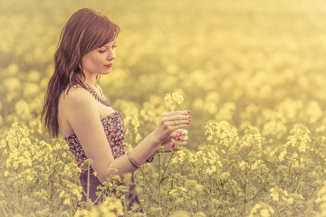 Beautiful authentic summer woman flower vintage visual. Attractive genuine young girl enjoying the...