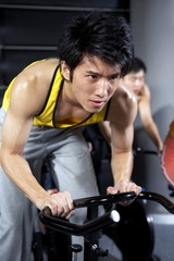 Fototapeta na wymiar Focused Young Man Exercising