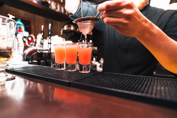 Barman stir alcohol. Process of preparing a cocktail
