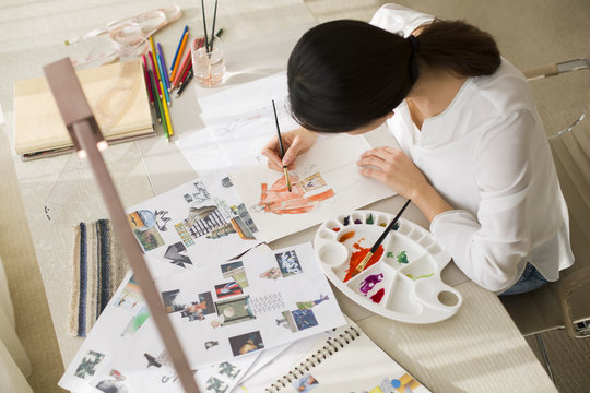 Fashion designer drawing sketch
