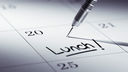 Concept image of a Calendar with a golden dart stick.. The words