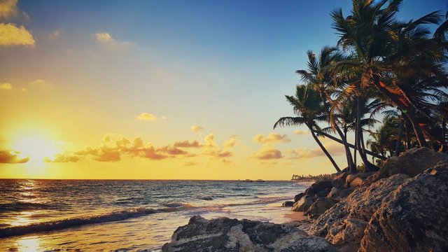 Sunrise over tropical beach in Punta Cana, Dominican Republic © ValentinValkov