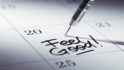 Concept image of a Calendar with a golden dart stick.. The words