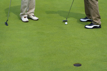 Fototapeta na wymiar Close-up of two golfers